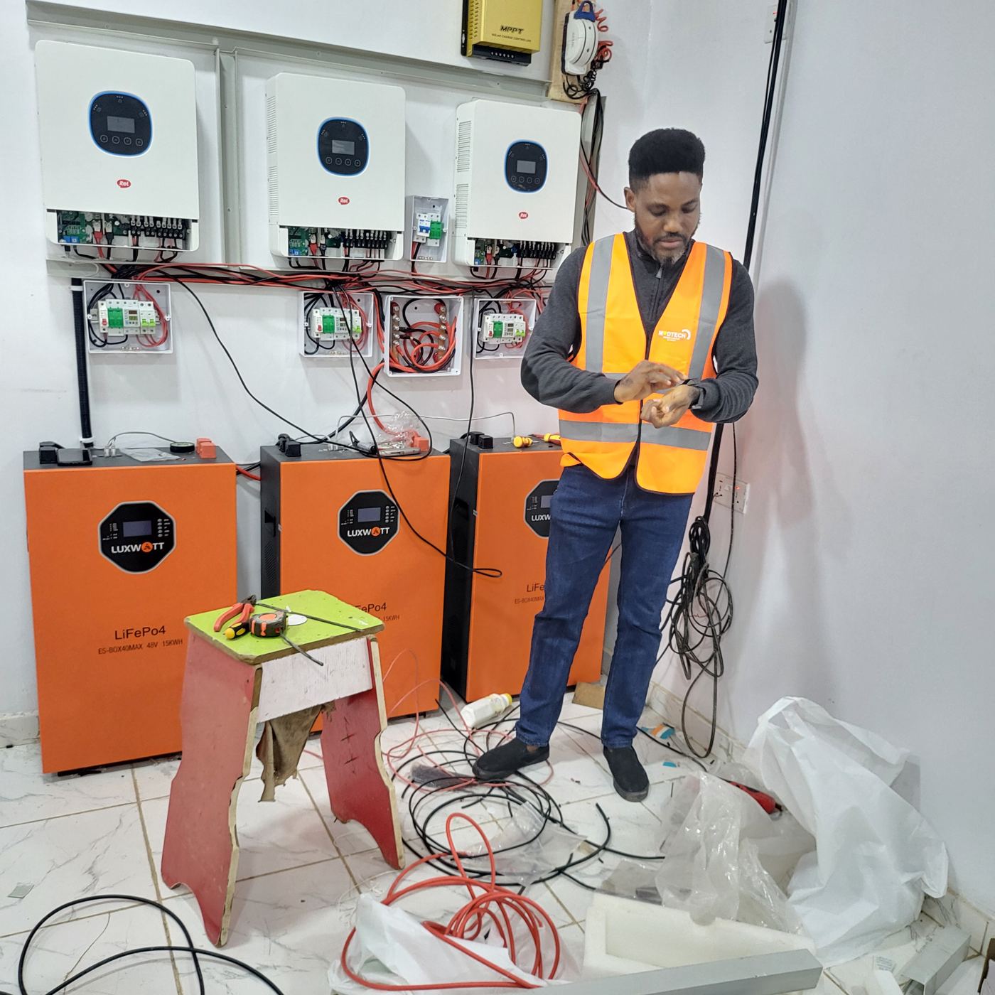 Modtech engineer commissioning a three-inverter lithium system